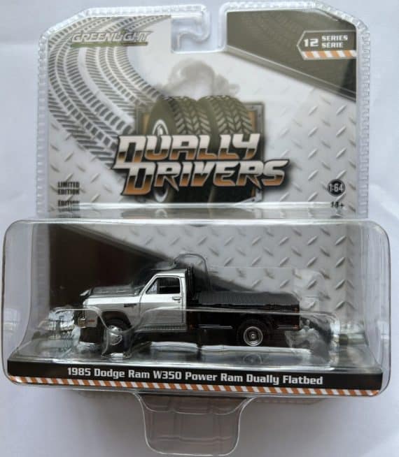 Greenlight 1/64 Dually Drivers Series 12 - 1985 Dodge Ram W350 Power Ram Dually Flatbed 46120-B