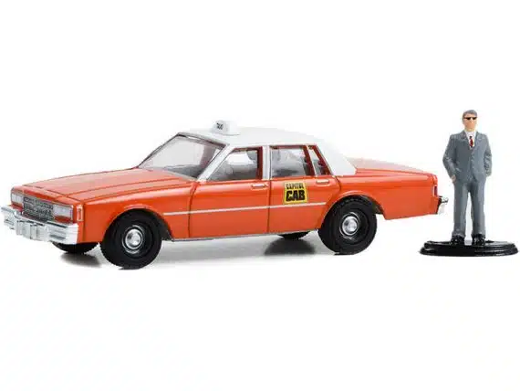 Greenlight 1/64 The Hobby Shop Series 15 - 1981 Chevrolt Impala Capital Cab with Man in Suit 97150-B