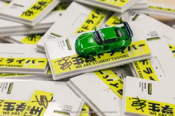 Tarmac Works 1/64 HOBBY64 RWB 993 Rough Rhythm Fuel Fest Student Driver T64-017-SD
